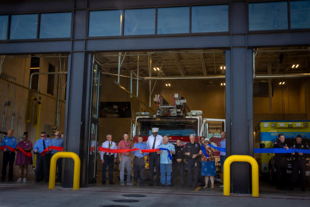 CIty of Austin leadership about to perform the ribbon cutting for Austin Fire Station number 22, EMS Station 12. Mayor Kirk Watson as well as Fire Chief Joel G. Baker and Capital Delivery Services Deputy Director Eric Bailey are present among others.